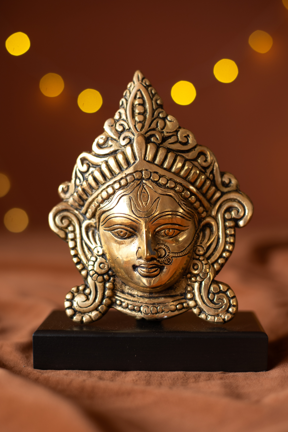 Brass Durga Face With Wood Stand