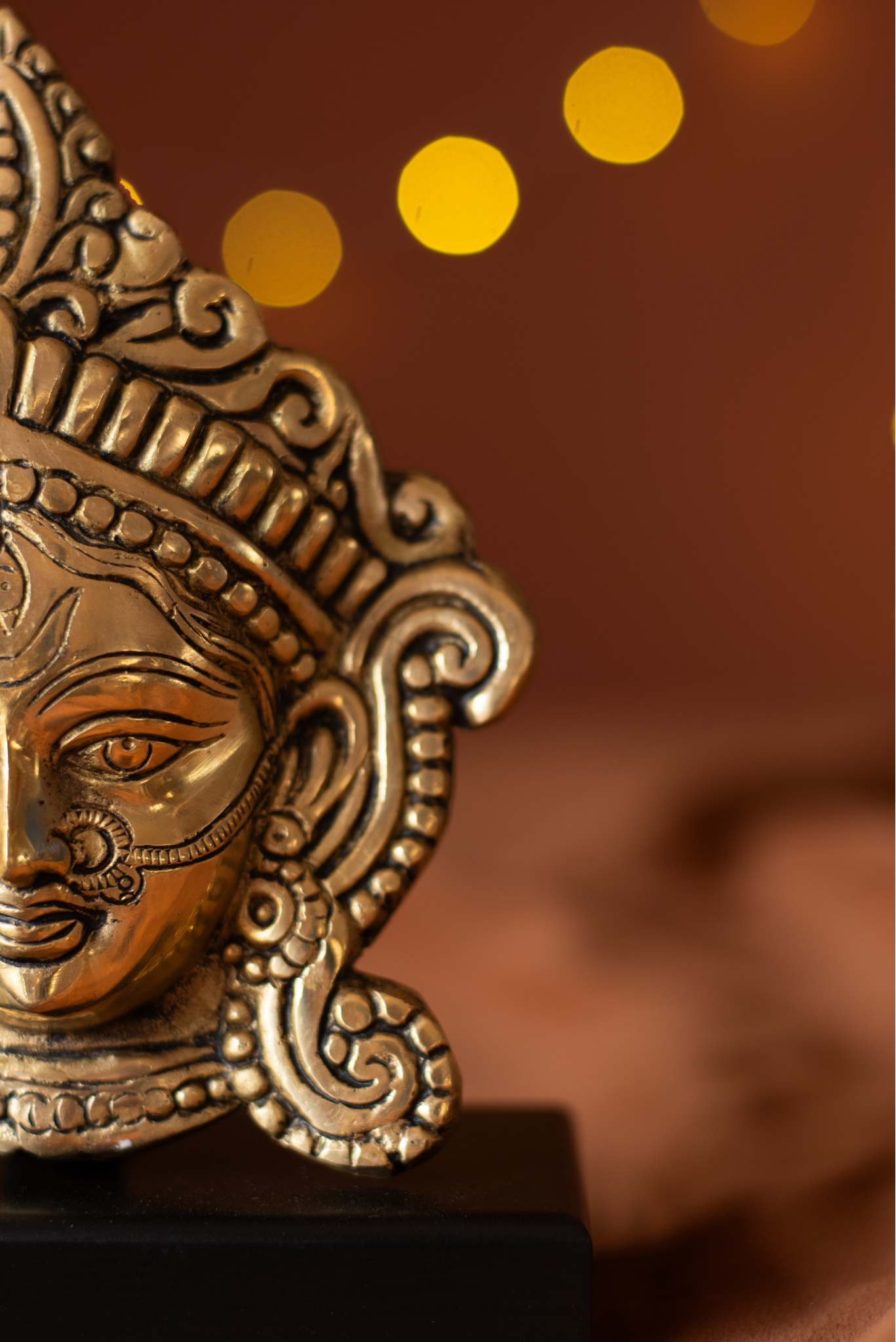 
                  
                    Brass Durga Face With Wood Stand
                  
                